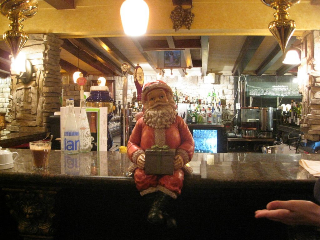 Santa Sittin on Bar Christmas Eve.